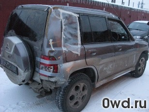 Битый автомобиль Mitsubishi Pajero IO