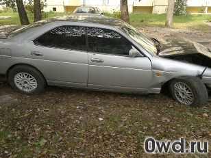 Битый автомобиль Nissan Laurel