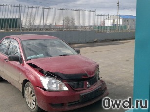 Битый автомобиль Mitsubishi Lancer